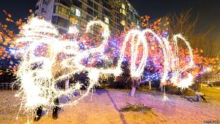 The word dragon is written in Chinese characters and as well as 2012 - all written in fireworks.