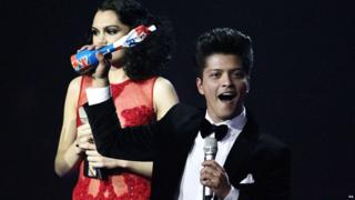 Bruno Mars collects his award