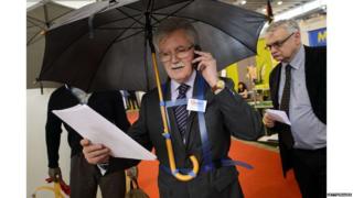 A man with a hands free umbrella