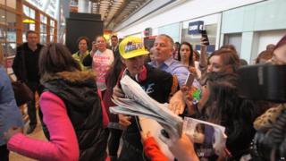 Justin Bieber mobbed by fans at London's Heathrow Airport