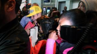 Justin Bieber mobbed by fans at London's Heathrow Airport