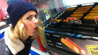Hayley next to a hot dog stand