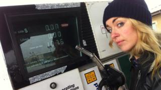 Hayley next to a petrol pump