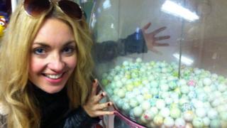 Hayley next to a gumball machine