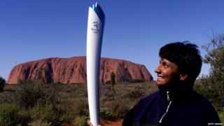 Nova Peris-Kneebone holds the Olympic torch ''Uluru'' prior to the torch arrival, June 7, 2000, at Uluru , Northern Territory, Australia.