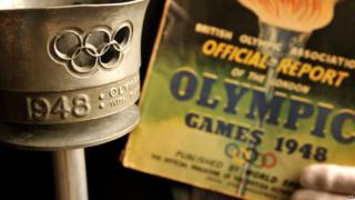 The London 1948 Olympic torch and programme which will go under the hammer during the Olympic Games.