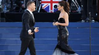 Gary Barlow and Cheryl smile at each other