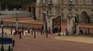 Guards enter Buckingham Palace