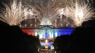 fireworks and beacon light up Buckingham Palace