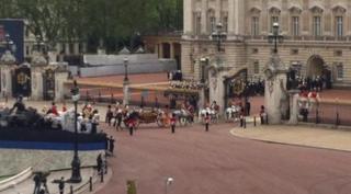 Queen arriving at Buckingham Palace