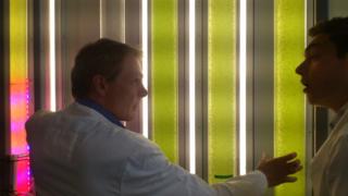 Professor Rod Scott shows Joe the tubes in which he grows plants that he then turns into fuel.