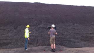 Joe in front of a coal mountain at Didcot Power Station.