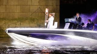 David Beckham had a starring role taking the Olympic flame on a James Bond style journey down the river Thames on a speed boat.