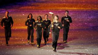 Seven young torch bearers lit the final flame.