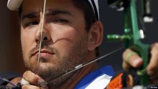 Italian player setting up during archery event.