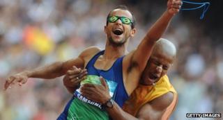 Blind athlete running with his guide