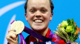 Ellie Simmonds holds up her second gold medal