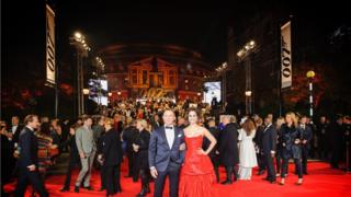 Daniel Craig and new bond girl Berenice Marlohe pose on the red carpet outside the Royal Albert Hall in London.