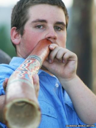 Lachlan playing the didgeridoo