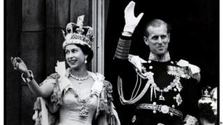 Queen and Duke waving at her Coronation.