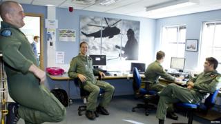 Britain's Prince William speaks to colleagues at RAF Valley in Holyhead, Wales