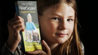 Martha Payne with her book Never Seconds