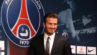 David Beckham and the Paris St-Germain logo