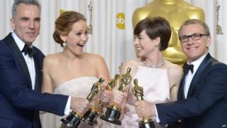 Daniel Day-Lewis, Jennifer Lawrence, Anne Hathaway and Christoph Waltz pose with their Oscars.