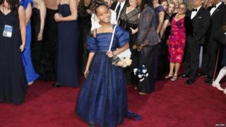 Quvenzhane Wallis arrives on the red carpet at the Oscars.