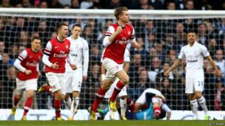 Per Mertesacker of Arsenal celebrating his goal