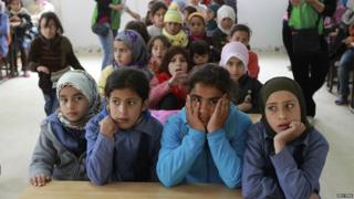 Children at a makeshift school in Zaatari refugee camp