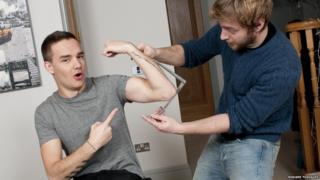 Liam from One Direction getting measured up for this Madame Tussauds waxwork