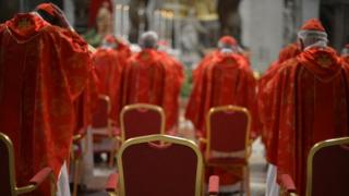 Cardinals praying during the papal election
