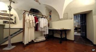 Robes made in different sizes ready for the new pope