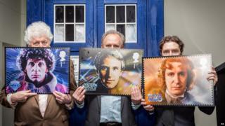 Peter Davison, Tom Baker and Paul McGann with their stamps
