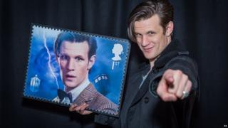Matt Smith holding a Doctor Who stamp