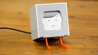 A little printer with a face.