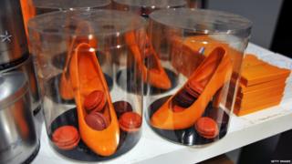 Orange edible shoes and macaroons are on sale to celebrate the new king. Orange is the national colour of the Netherlands.