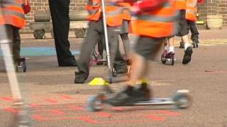 Children on scooters