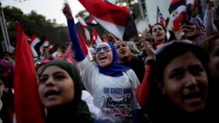 People protest against President Morsi's rule outside the Presidential Palace on 30 June 2013.