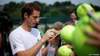 Andy Murray signs autographs.