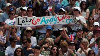 Fans hold banner supporting Murray.