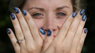 Woman with Andy Murray nail art.