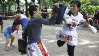Woman takes part in martial arts class