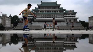 Children skate around Kim Il-Sung Square in Pyongyang, North Korea