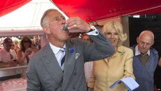 The Prince of Wales eats an oyster with the Duchess of Cornwall at the Whitstable Oyster Festival in Kent.