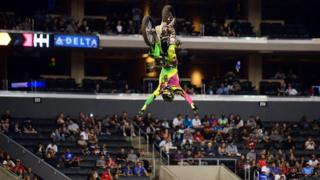 Andre Villa performs at stunt at the Moto X Games in Los Angeles, California.