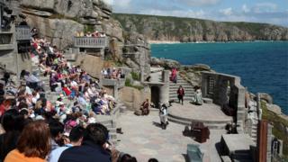 People watch a performance of Wuthering Heights at the Minack Theatre in Cornwall.