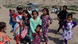 Children wearing new clothes in Afghanistan