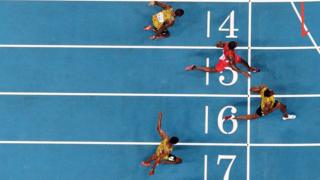 Usain Bolt crossing the finish line.